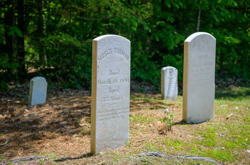 Two grave stones with the names Moses Tubman and Emeline Tubman on them.